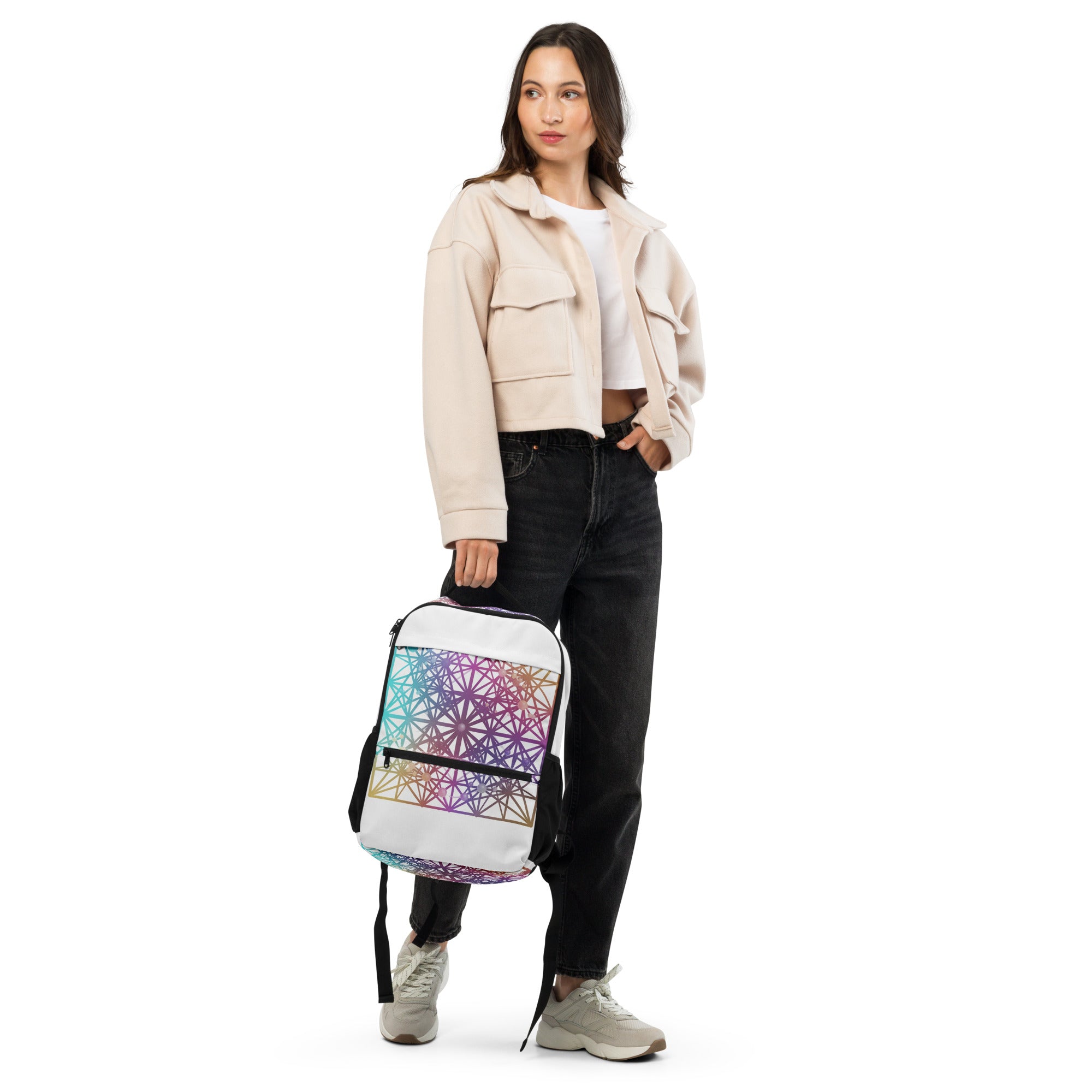 Front view of woman wearing Cymatics Heart Sacred Geometry Utility Backpack showing cosmic heart design