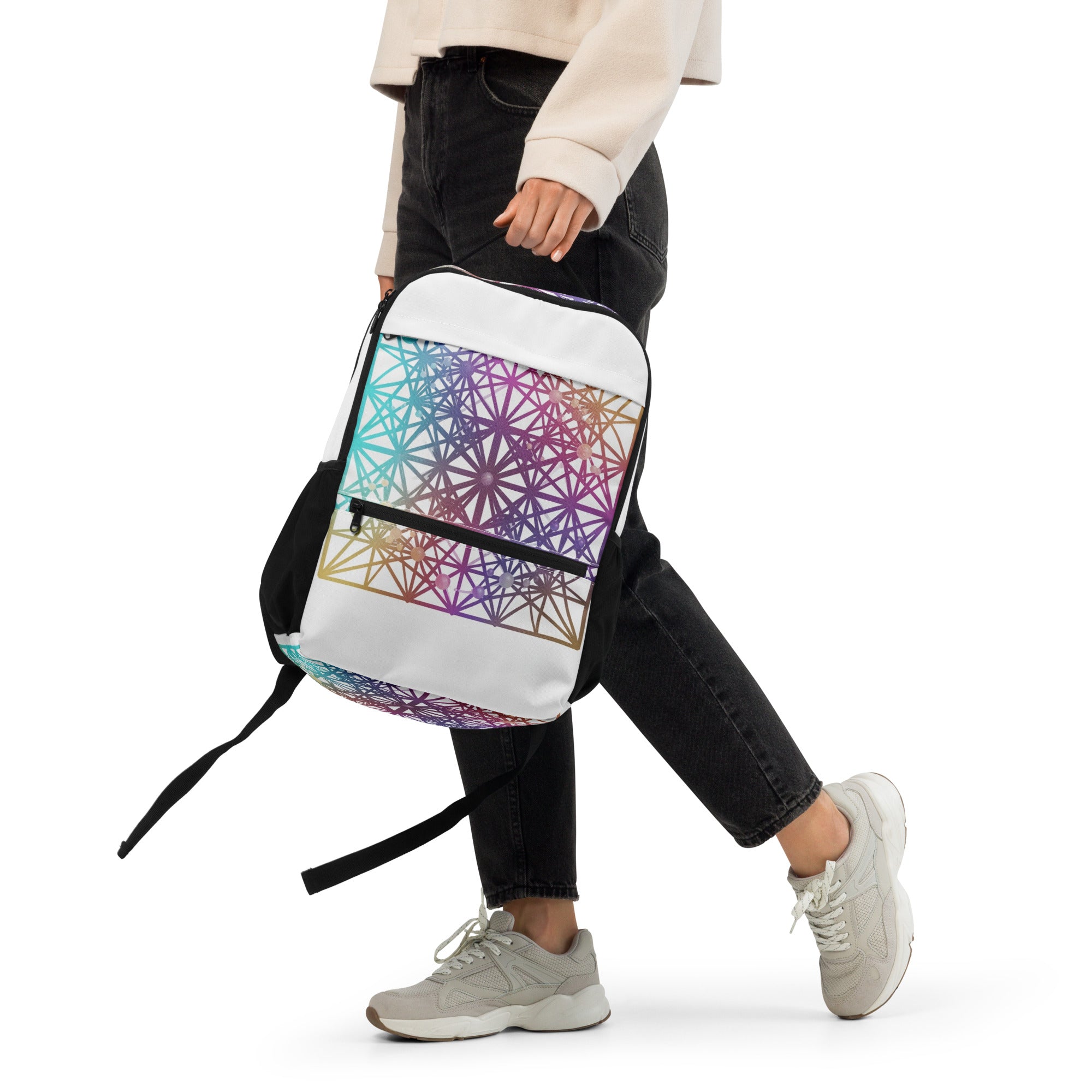 Woman walking while wearing Cymatics Heart Sacred Geometry Utility Backpack, lifestyle shot