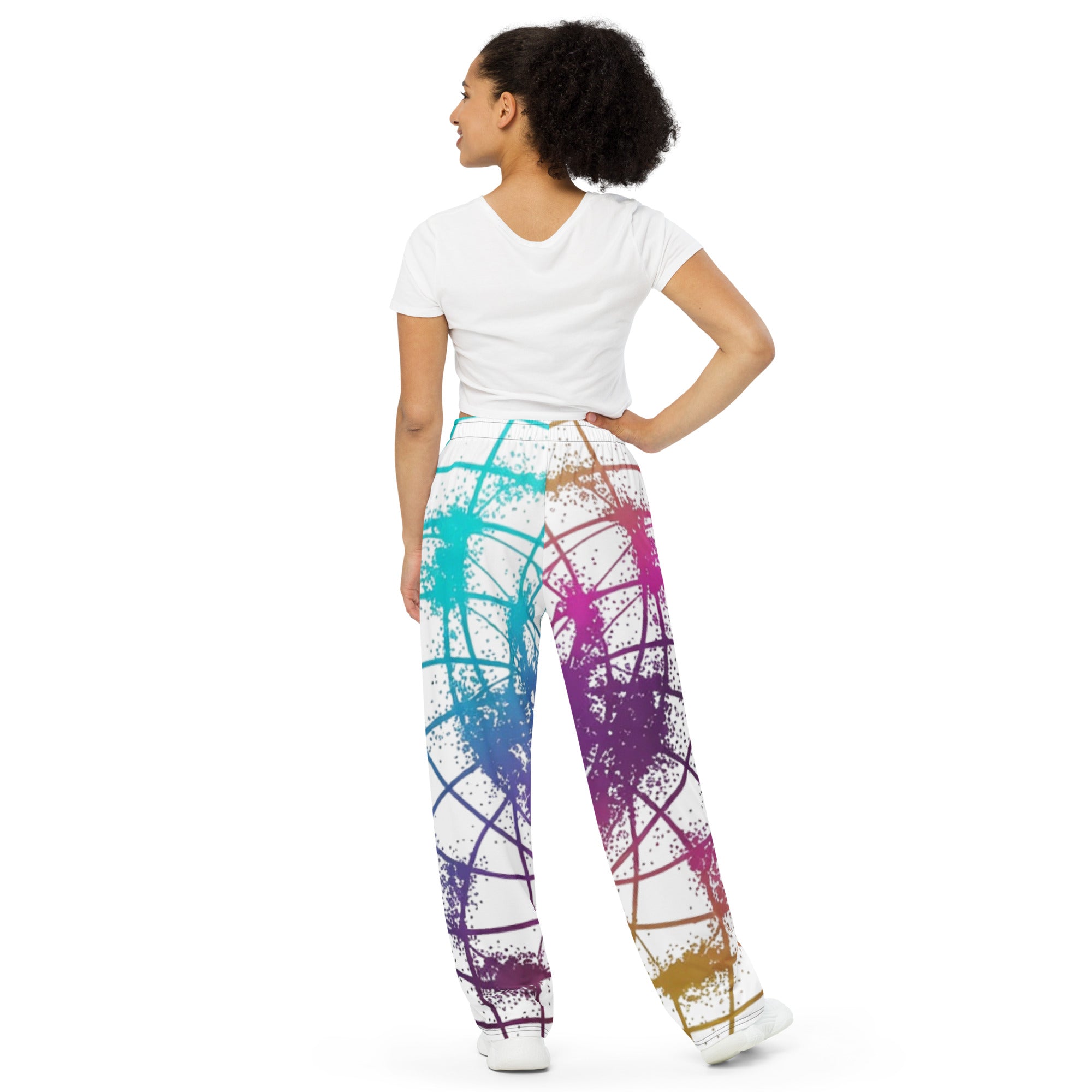 Woman standing in Cymatics Heart Sacred Geometry Wide-Leg Pants, comfortable spiritual yoga pants with heart cymatics design back