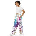 Woman wearing Cymatics Heart Sacred Geometry Wide-Leg Pants with glowing heart mandala cymatics pattern, spiritual awakening clothing for yoga and conscious living