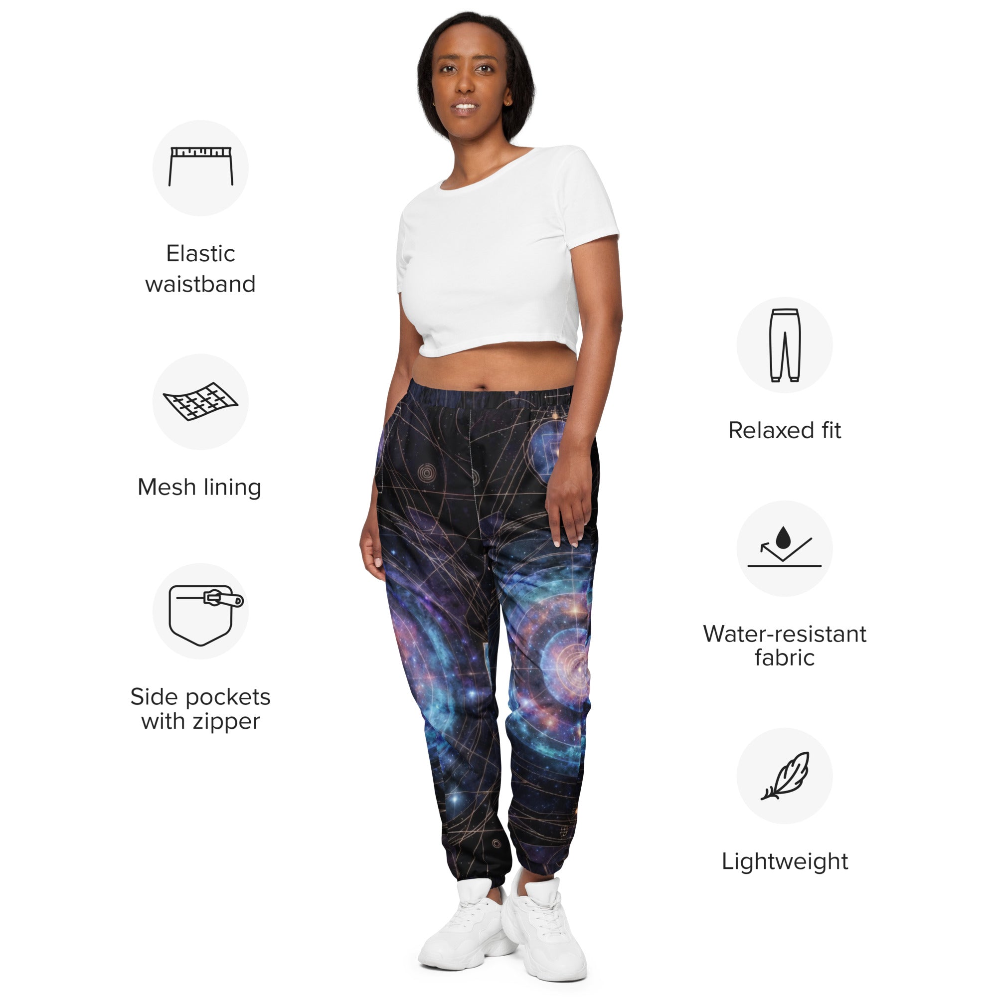 Woman wearing Galaxy Sacred Geometry Unisex Track Pants in cosmic mandala design, full body view