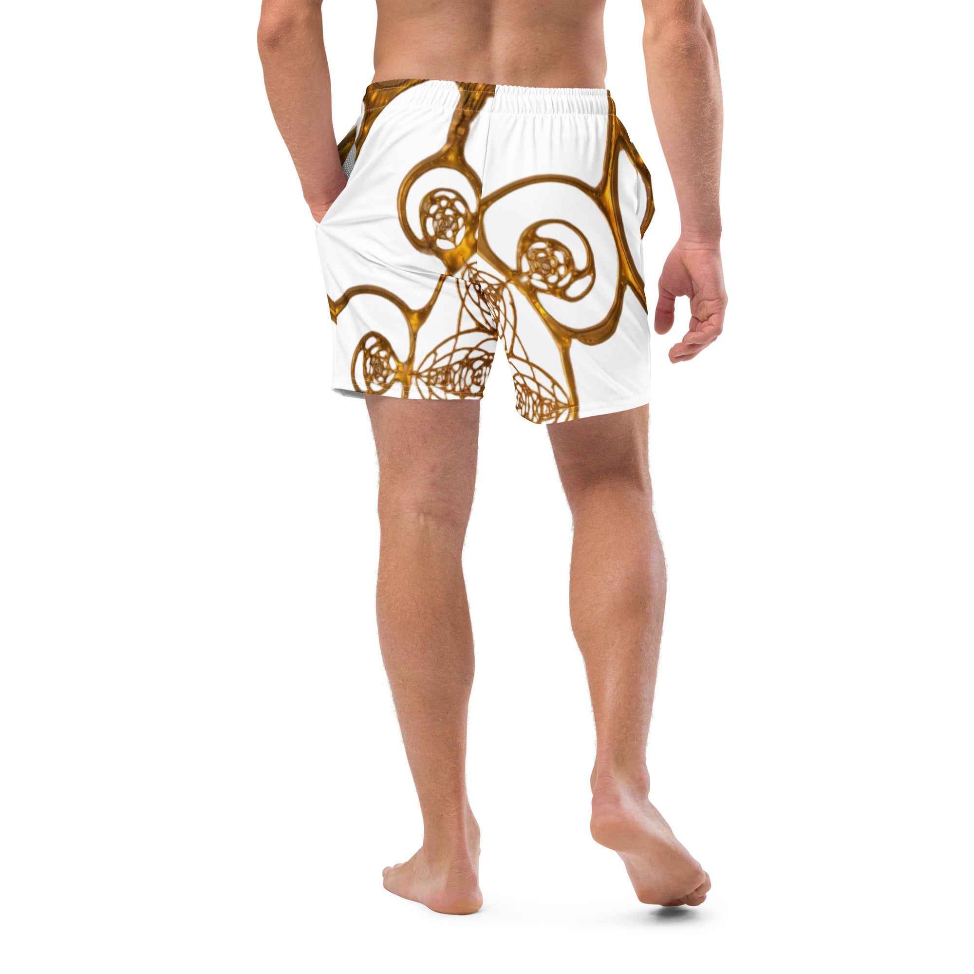 Close-up front view of golden cymatics sacred geometry pattern on recycled swim trunks
